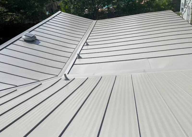 Solar attic fan installed on a metal roof for Roof Ventilation in Braselton